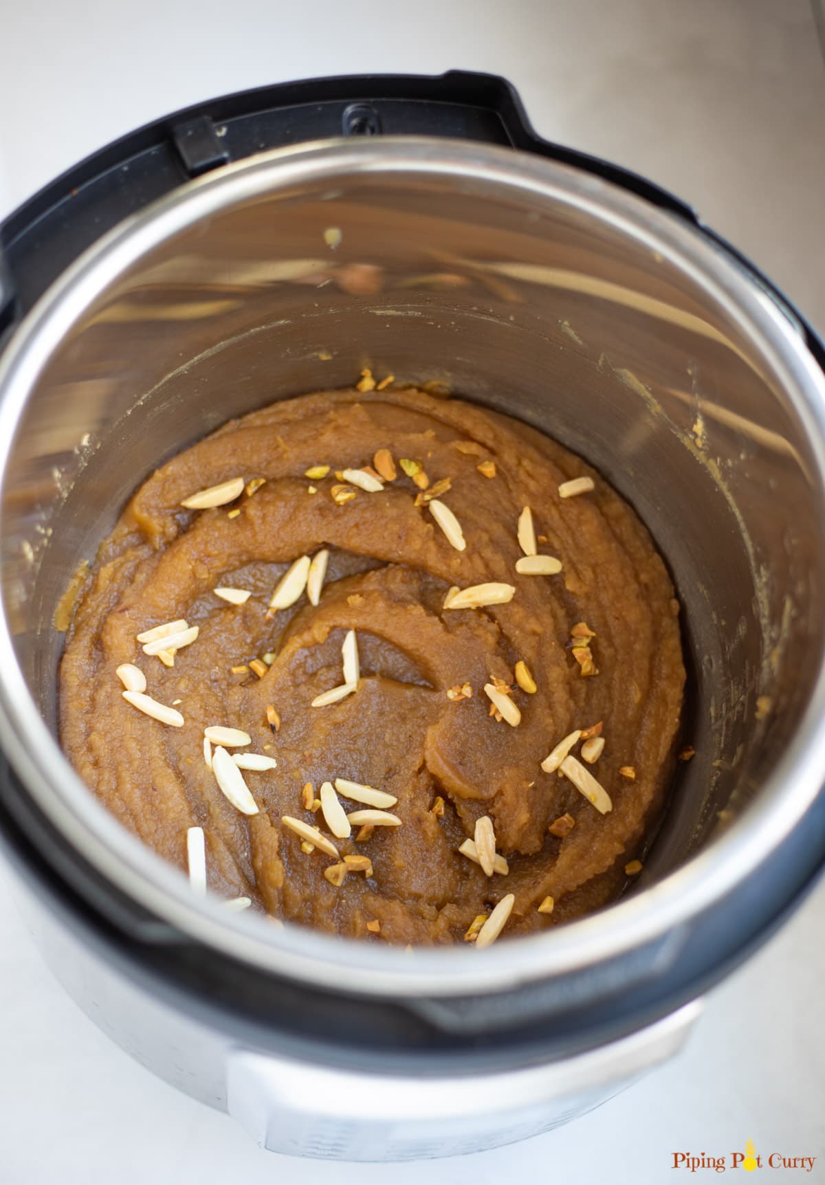 Halwa garnished with sliced almonds in the instant pot