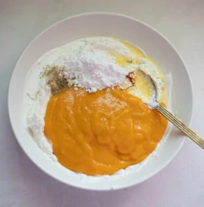 All ingredients combined to make shrikhand with mango pulp