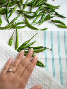 Dry green chili using a kitchen towel