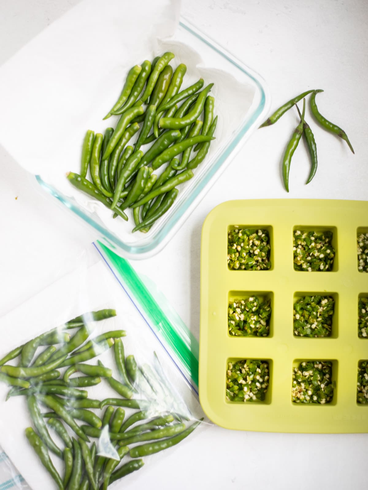 Various ways to store green chili peppers - in a ziplock, in a container in paper towel or as green chili paste in ice-cube trays