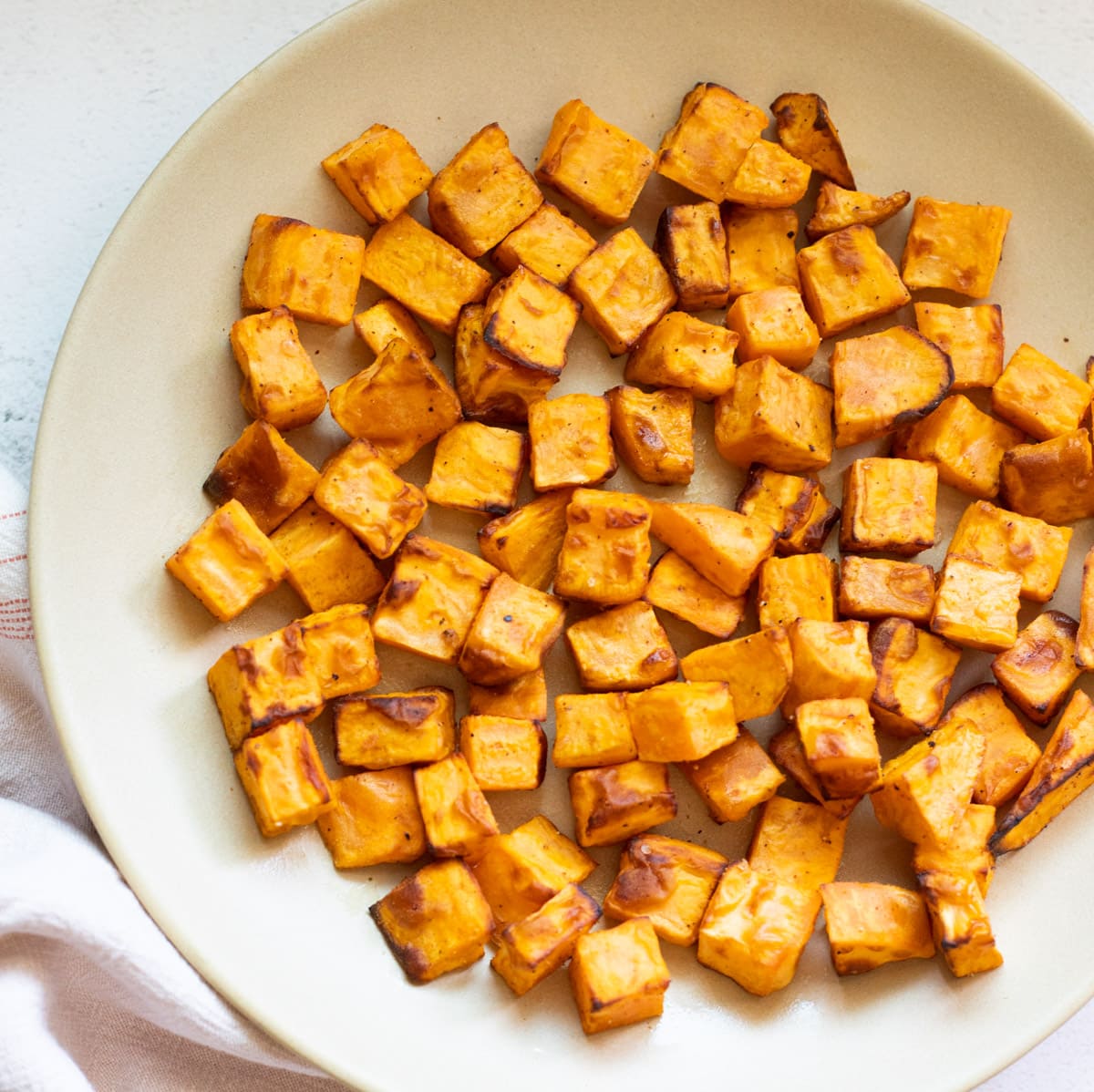 roasted sweet potatoes in a white plate