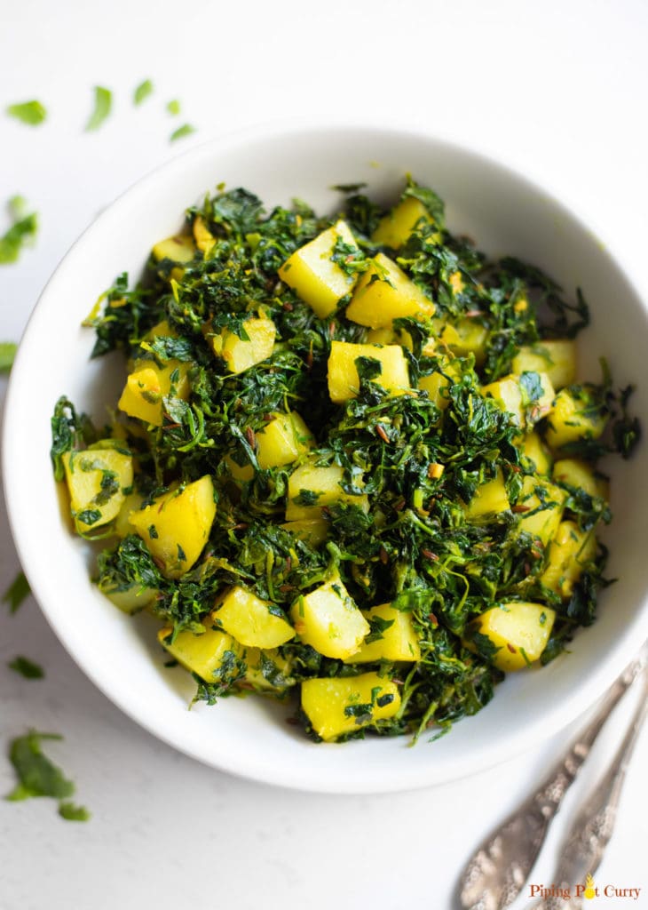 Aloo Methi ki Sabji in a white bowl
