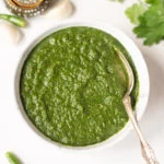 Indian green mint cilantro chutney in a white bowl