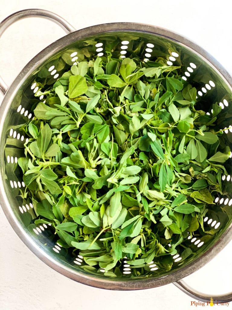 Fenugreek leaves in a colander