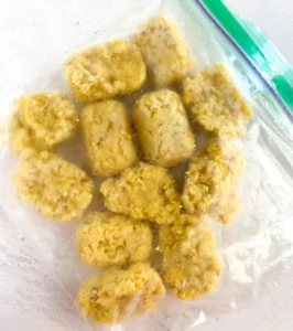 Frozen ginger cubes in a ziploc bag