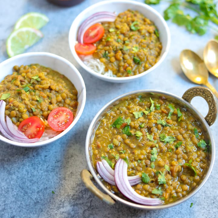 one bowl of masoor dal topped with onion and 2 bowl of masoor dal with rice topped with onion and tomato