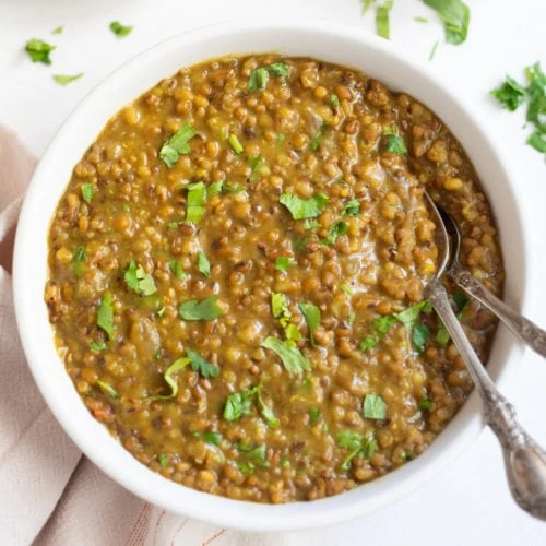 Moth beans dal in a bowl garnished with cilantro
