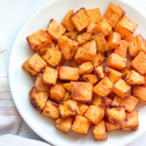 Roasted sweet potatoes in a white plate