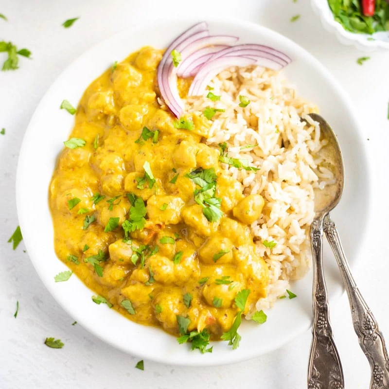 Coconut Chickpea Curry served over rice in a plate