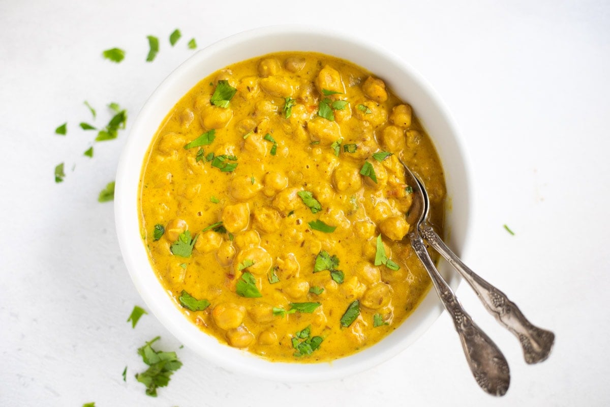 Coconut chickpea curry in a bowl garnished with cilantro 