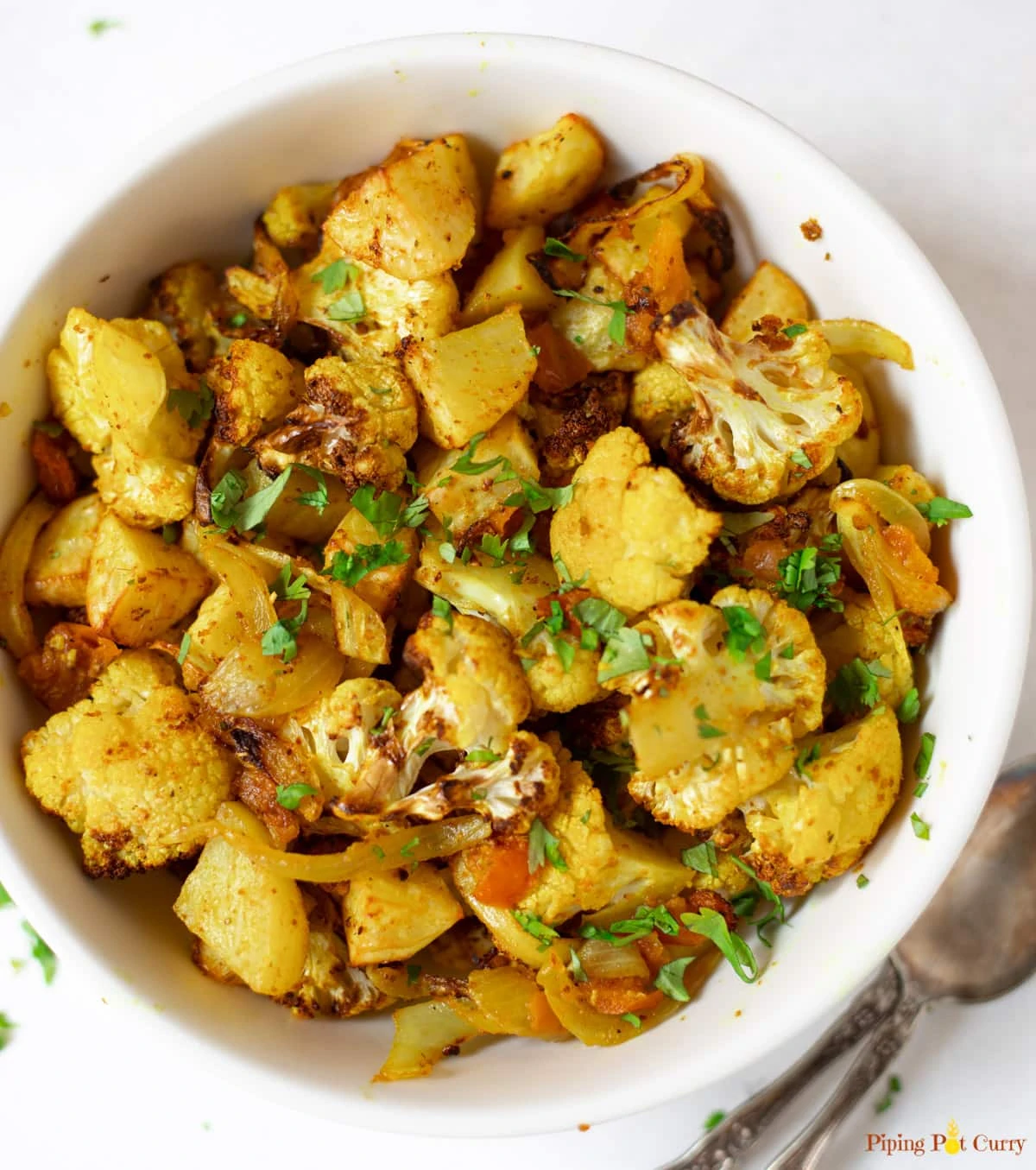 Indian Roasted Aloo Gobi (Potatoes and Cauliflower) in a bowl