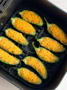 jalapeno poppers in air fryer stuffed with spiced mashed potatoes topped with cheese