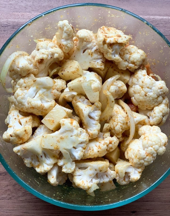 Spices mixed in potato and cauliflower 