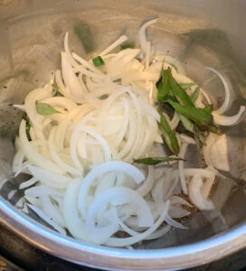 Onions, curry leaves, green chili pepper in the instant pot