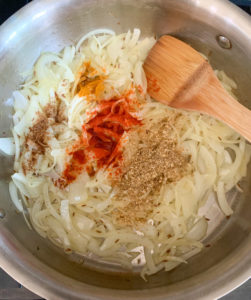 cooked onions and spices in a pan