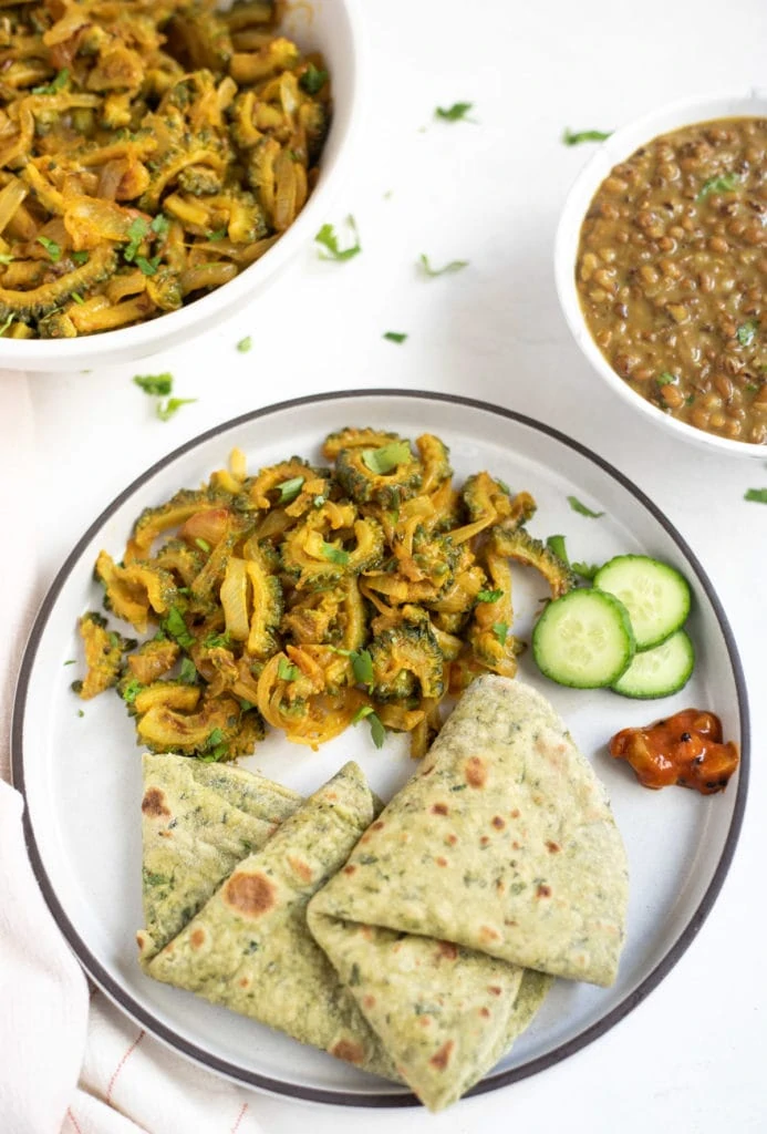 Karela subji served with chapati and dal 
