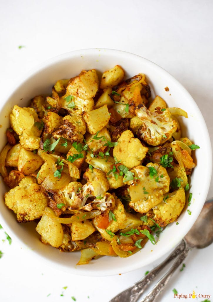 Indian spiced cauliflower and potatoes (Aloo Gobi) in a white bowl
