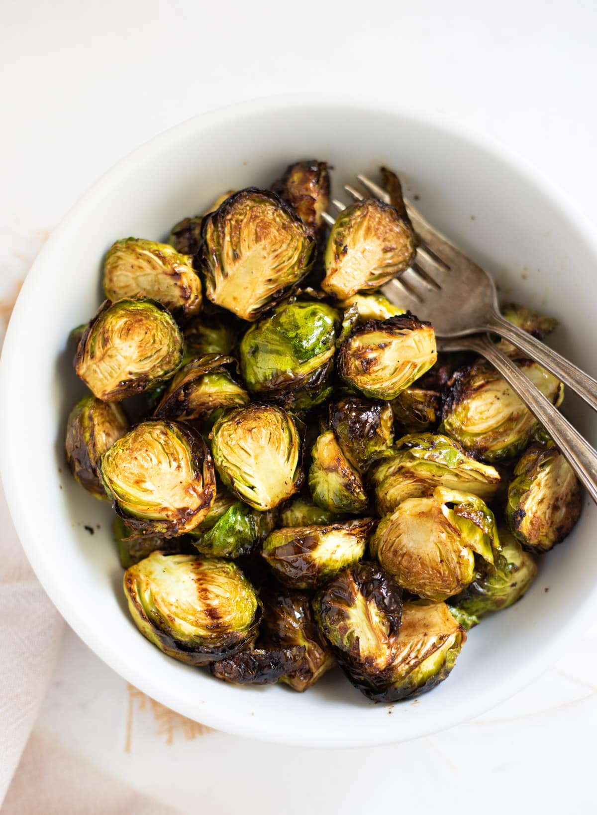 Roasted Air Fryer Brussels sprouts in a white bowl