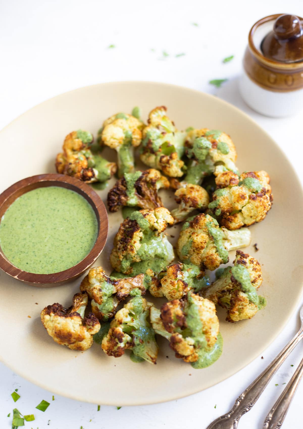 Roasted cauliflower topped with green cilantro sauce