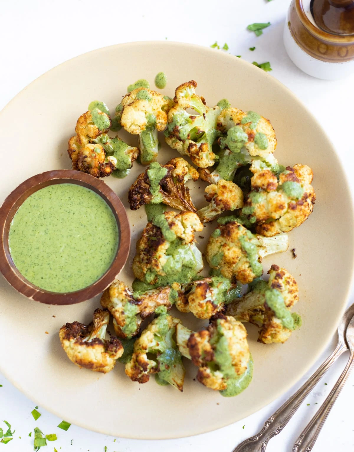 Roasted cauliflower topped with green cilantro sauce 