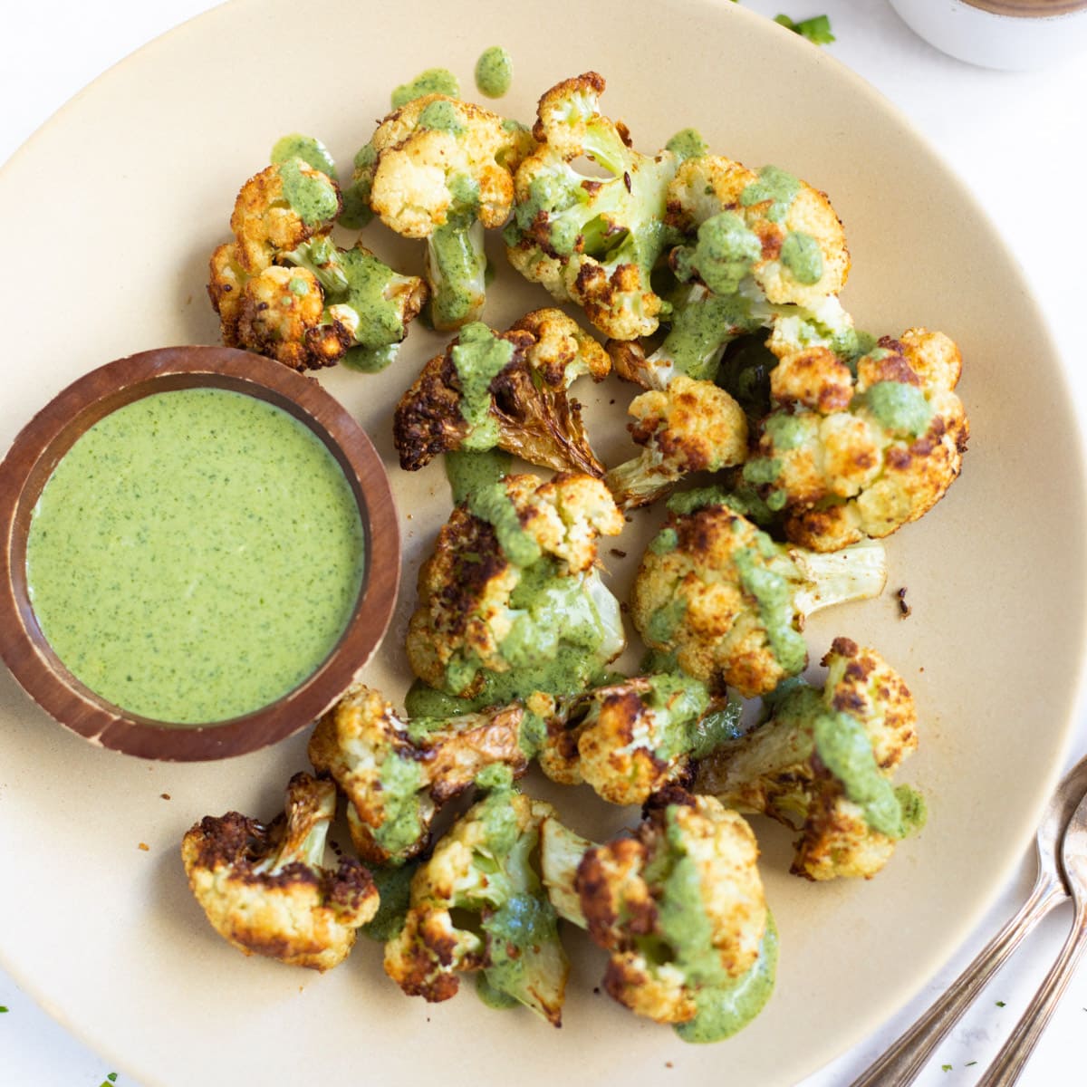 Roasted cauliflower topped with green cilantro sauce