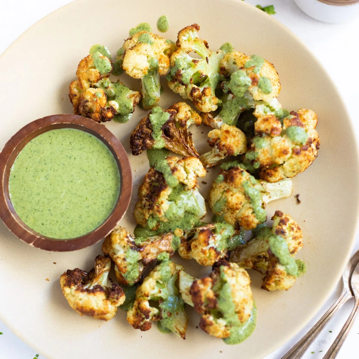 Roasted cauliflower topped with green cilantro sauce