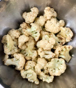 Cauliflower mixed with spices and oil