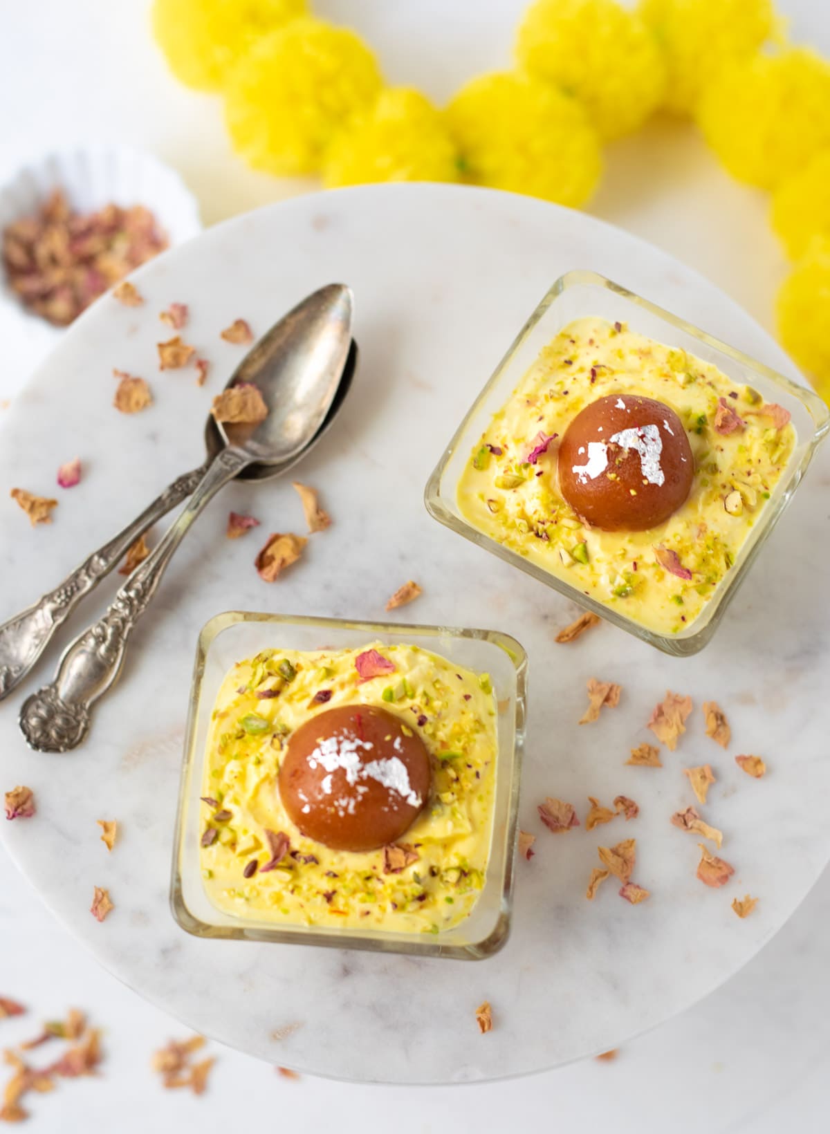 Gulab Jamun Shrikhand Cups on a pretty marble table 