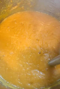 Sweet potato carrot soup blended with a hand blender