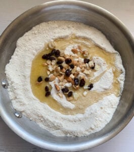 Making rava ladoo with nuts and raisins