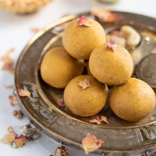 besan ladoo in a silver plate