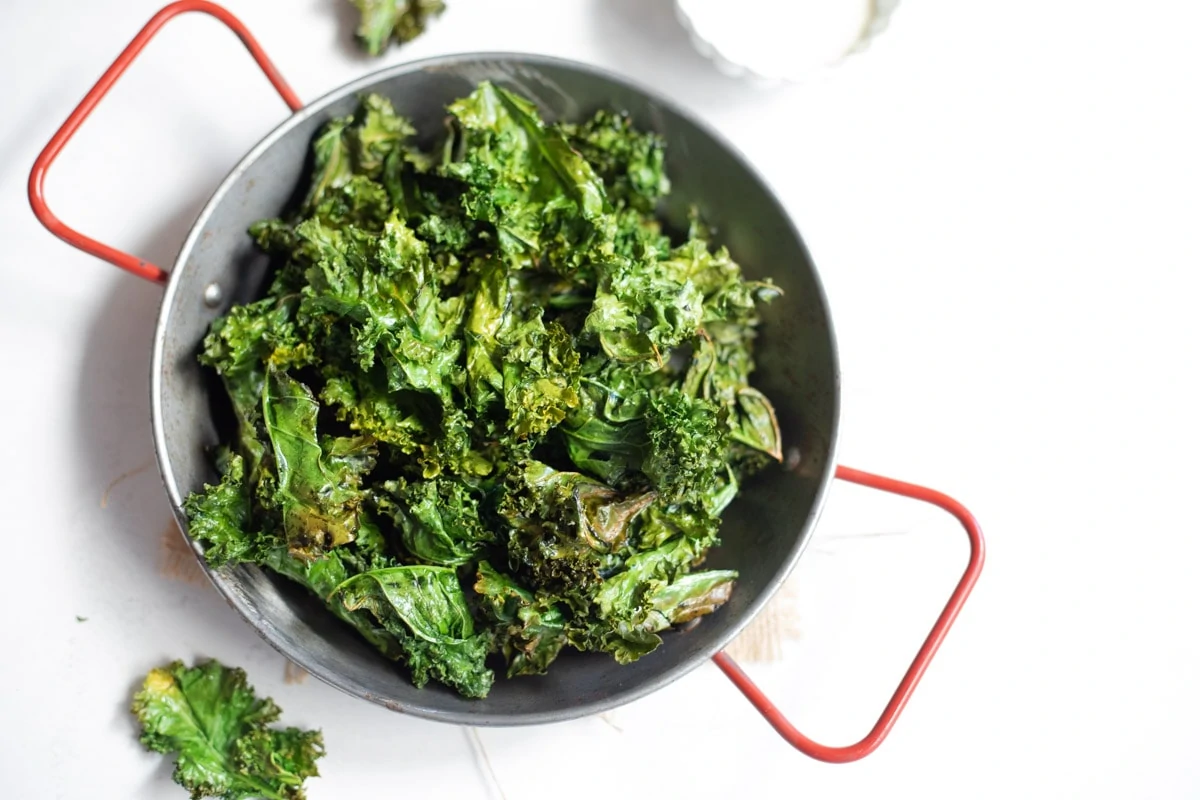 Crunchy air fryer kale chips in a bowl 