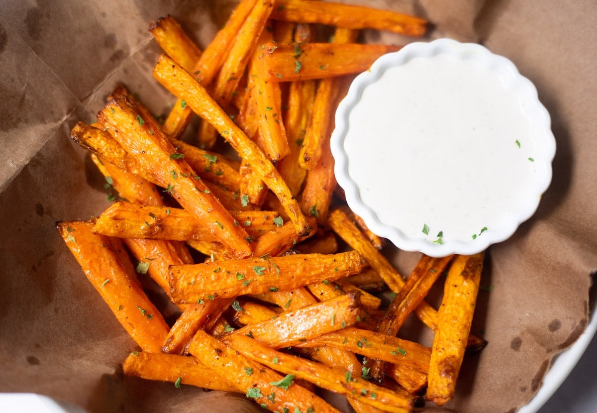 air fryer carrot fries with a bowl of dip