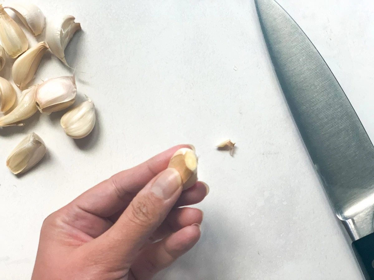 trimmed root end of a garlic clove