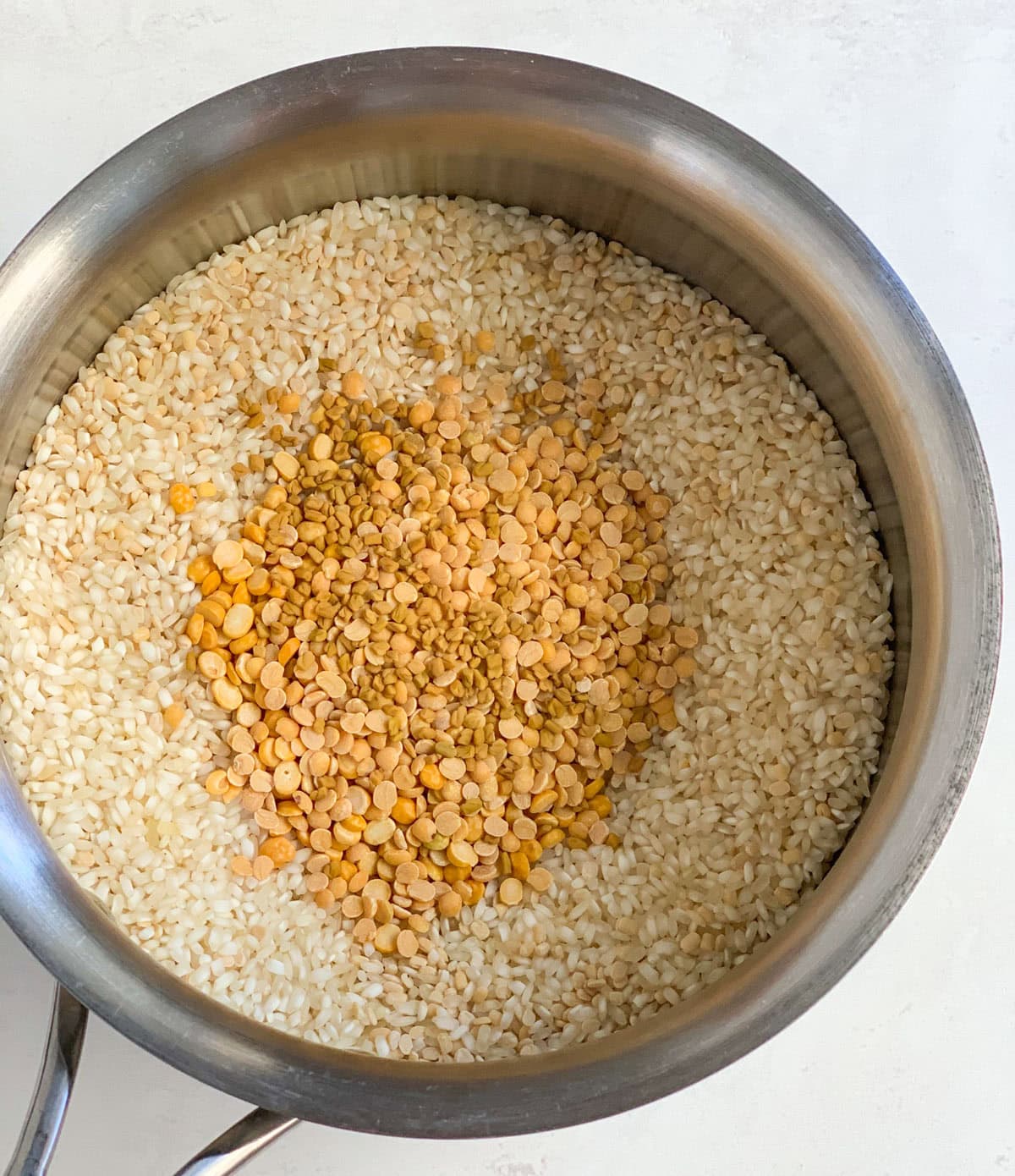 Rice and dal in a bowl to make dosa batter