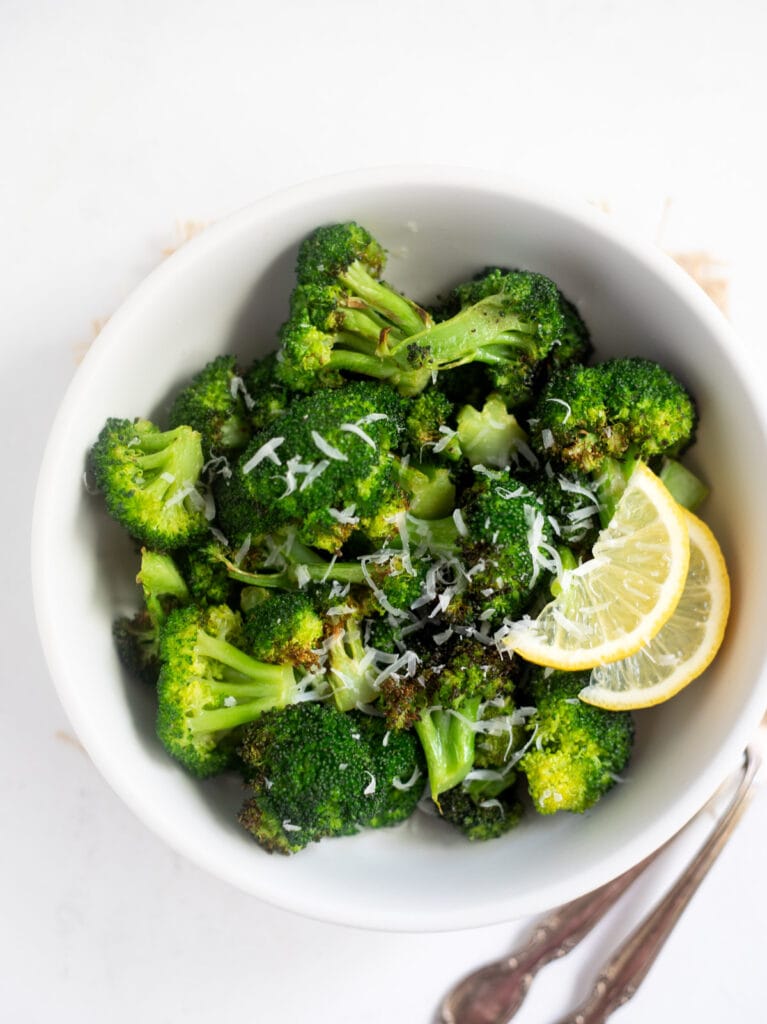 Roasted broccoli topped with lemon and parmesan