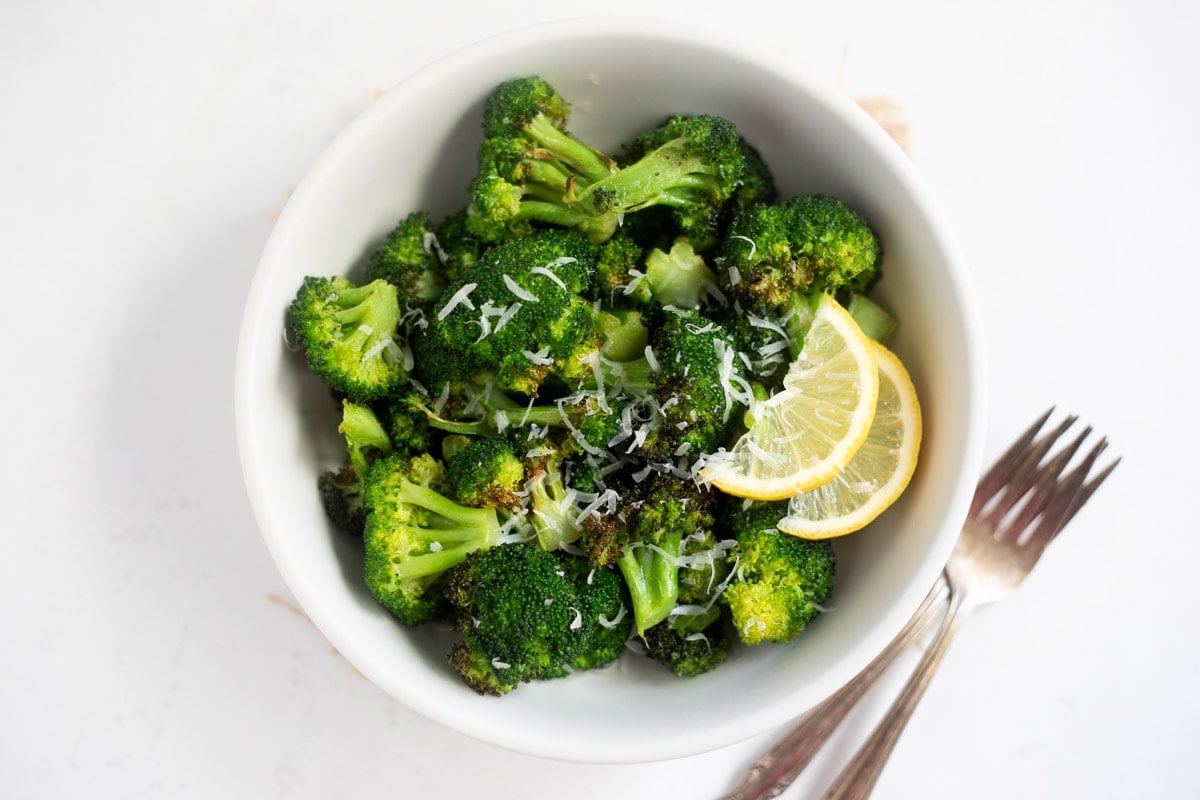 Roasted broccoli topped with lemon and parmesan