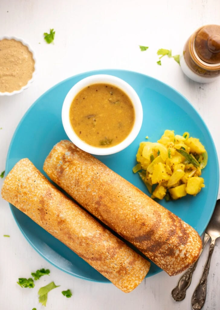 Two quinoa dosa with sambar, potato and chutney 