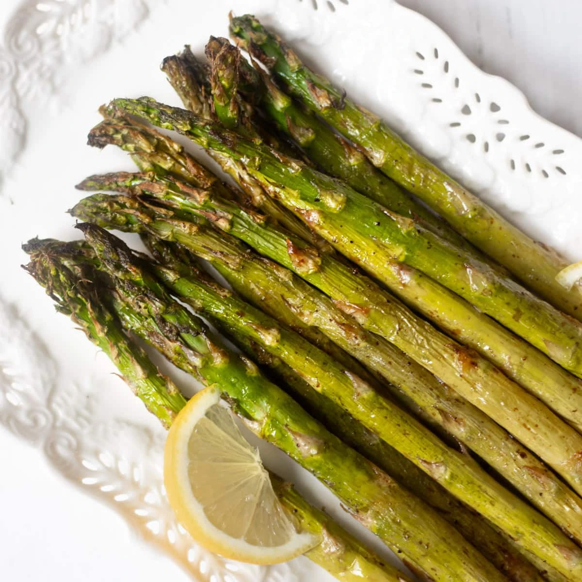 roasted asparagus a pretty white serving plate