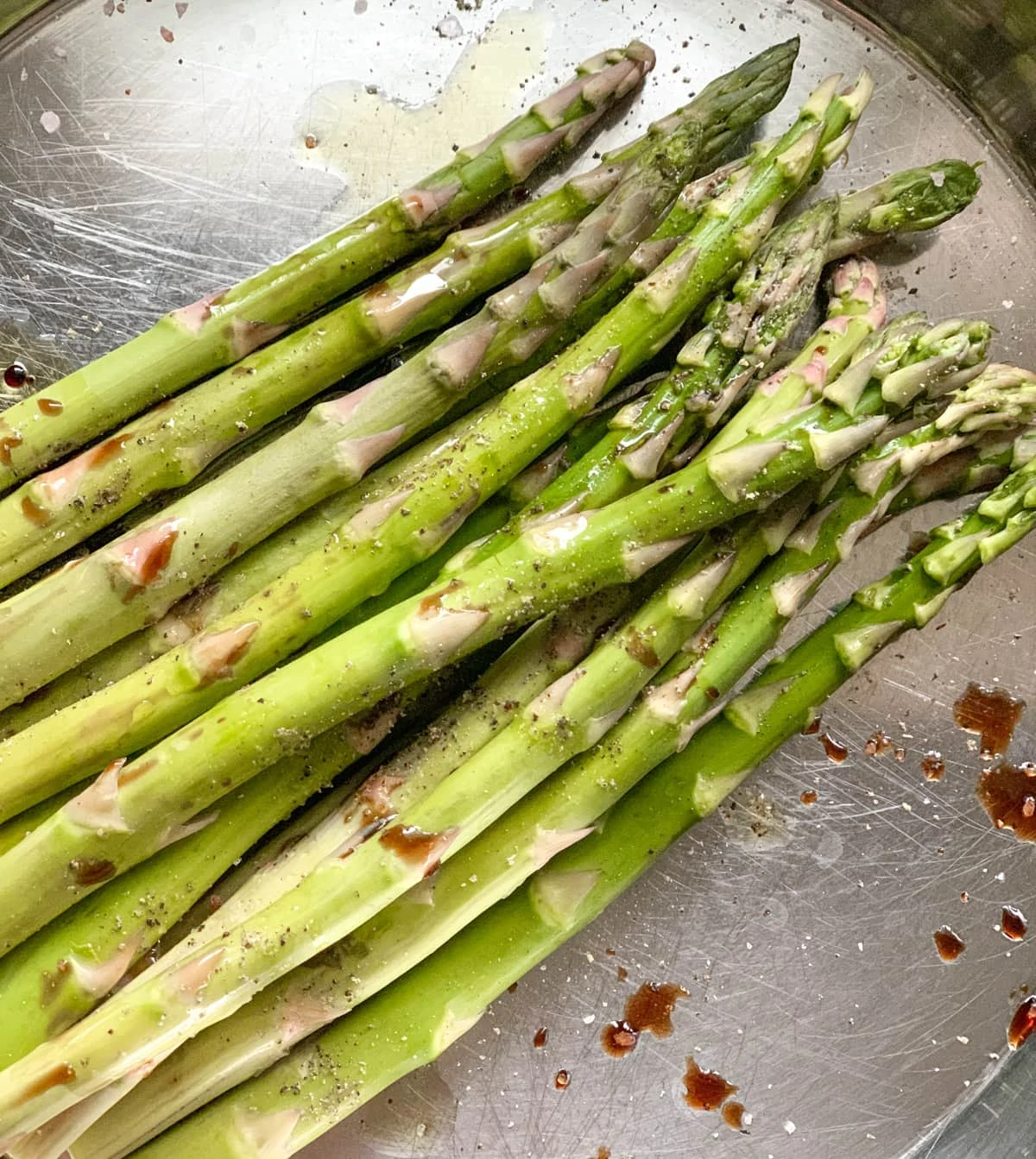 asparagus spears seasoned with oil and balsamic