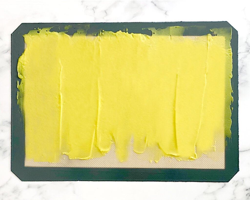 spread Khandvi batter in a silicone mat
