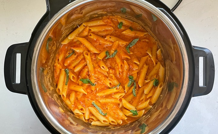 Penne Alla Vodka topped with basil in the instant pot