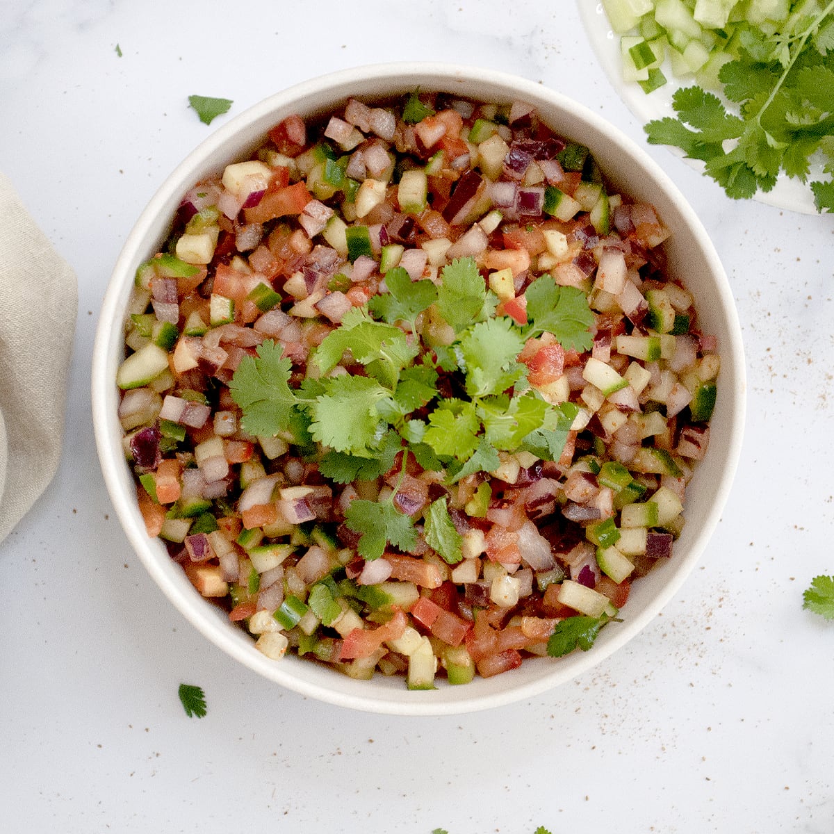 Kachumber salad in a bowl garnished with