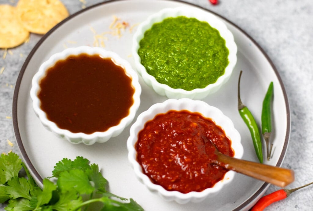 3 indian chutneys in small bowls