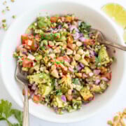 Sprouted beans salad in a bowl topped with chopped peanuts.