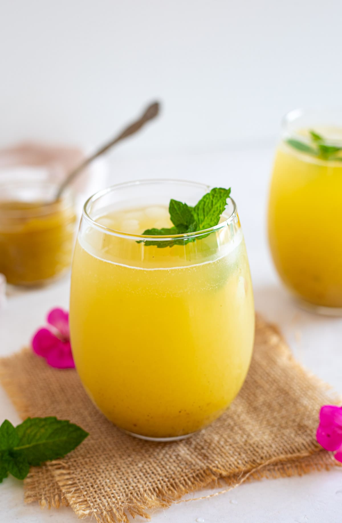 Aam Panna in a glass garnished with mint leaves