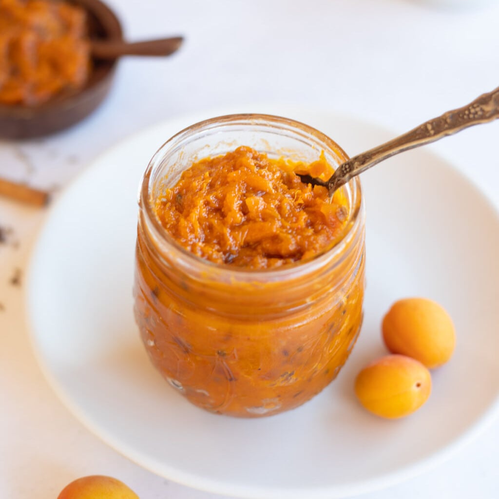 Apricot chutney preserve in a glass mason jar. 