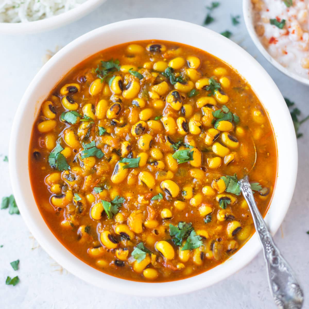 Black eyed peas curry (chawli) in a bowl garnished with cilantro