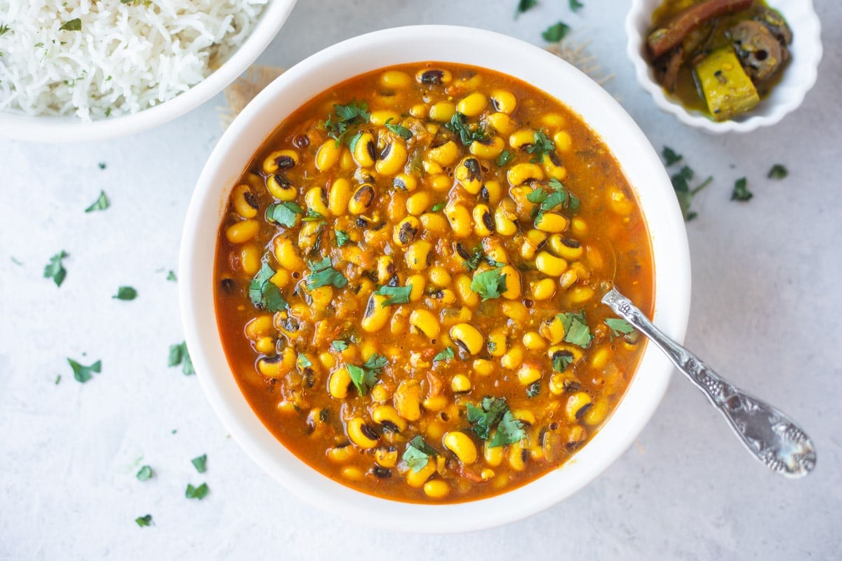 Black eyed peas soup in a bowl garnished with cilantro 