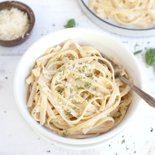 Instant pot Fettuccini Alfredo served in a bowl topped with parmesan